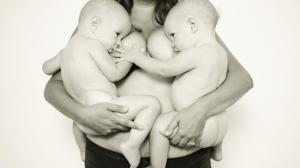 Mother-of-nine Lovelyn Palm breastfeeding her twins Emilia and Evelyn. Picture: Ashlee Wells Jackson 