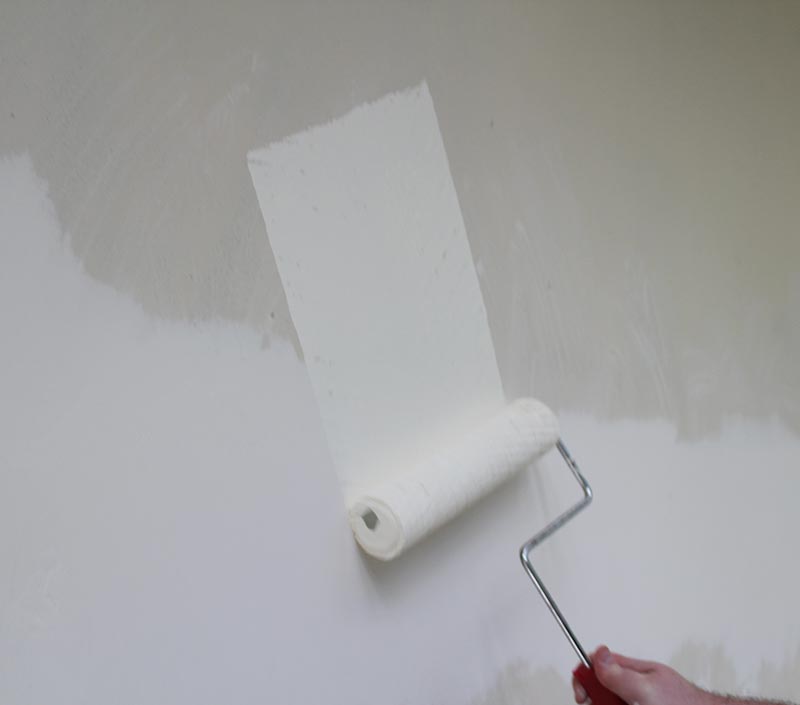 Painting the wall white, before you add the blackboard paint.