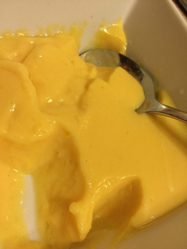 Tasting the finished product. It tasted amazing and so mangoey. Loved it and will give it another go. I was very happy as it was my first attempt at making Mango Pudding.