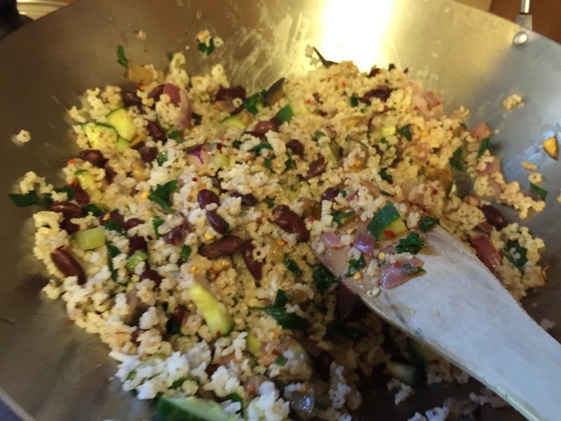 Making the stuffing: Cooking the beans, rice, and with all the other ingredients.