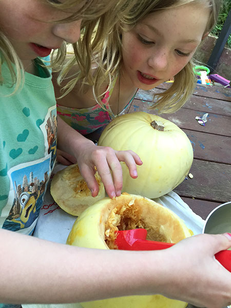 Cleaning out the inside of our Ghost Pumpkins.